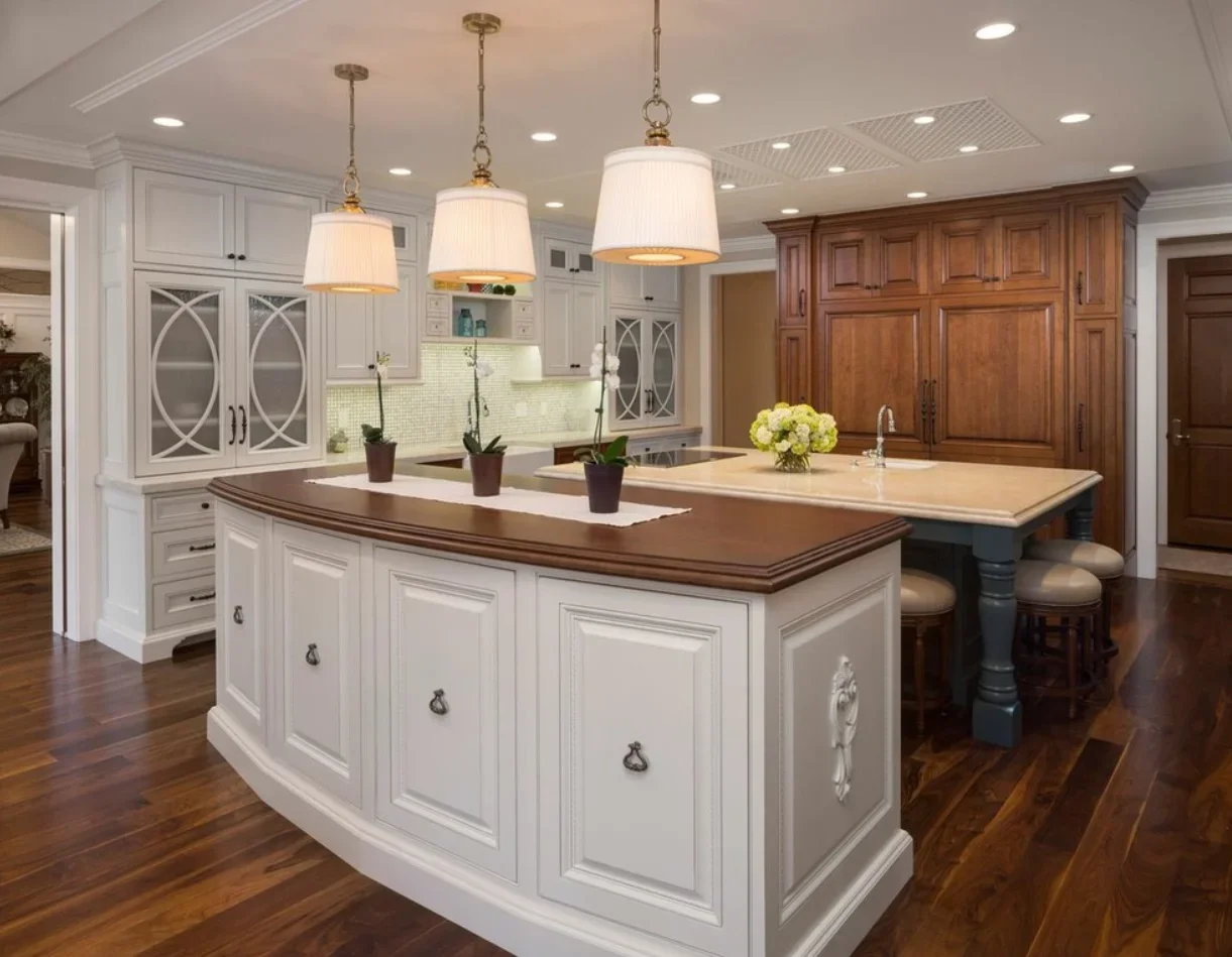White kitchen cabinets with geometric patterned glass doors and dark wood island countertop