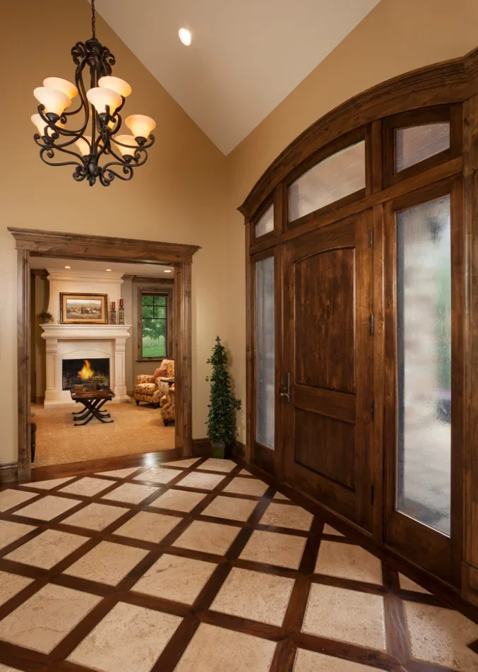 Elegant entryway with custom wood-frame glass doors and frosted panels
