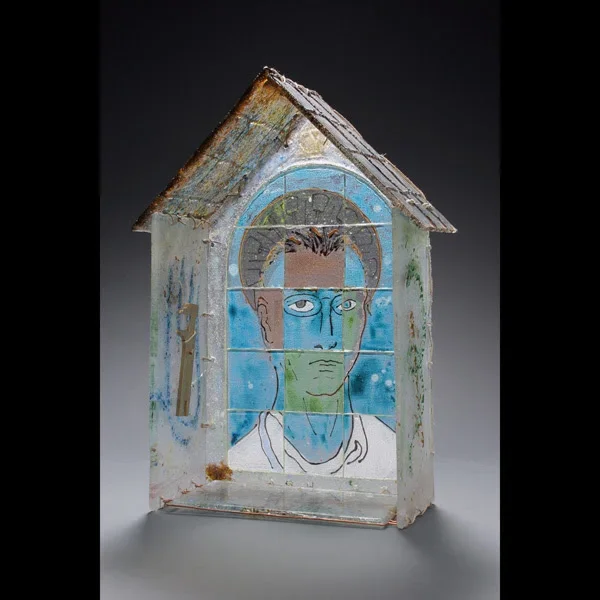 Artistic glass portrait panel in blue and green tones mounted in wooden house-shaped frame